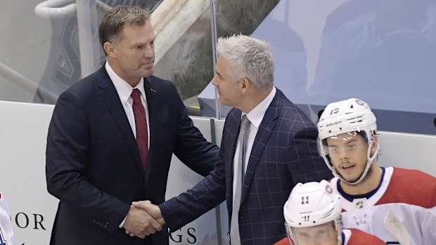Montreal Canadiens assistant coach Kirk Muller, left took the spot after head coach Claude Julien is out due to health issues for their game against the Philadelphia Flyers in game two of the first round of the NHL playoffs.